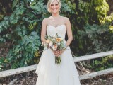 a strapless mermaid wedding dress with a lace bodice and a layered skirt with a train is classics