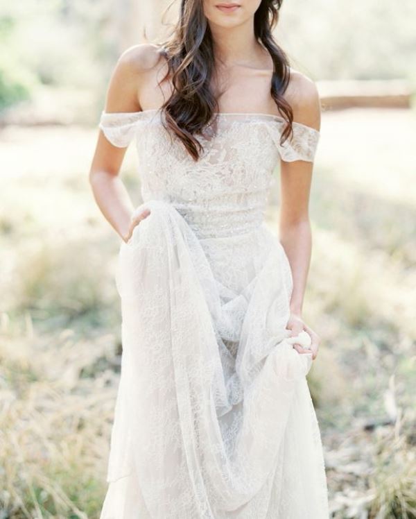 A lace off the shoulder wedding dress brings a boho feel and a touch of chic