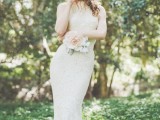 a neutral lace fitting wedding dress with no sleeves always works and looks pretty