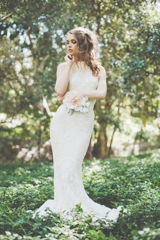 A neutral lace fitting wedding dress with no sleeves always works and looks pretty