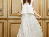 a non-typical wedding separate with a plain top with floral shoulders and an airy lace A-line skirt