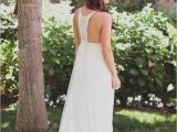 a boho plain wedding dress with a macrame racer back and no sleeves looks chic and feels relaxed