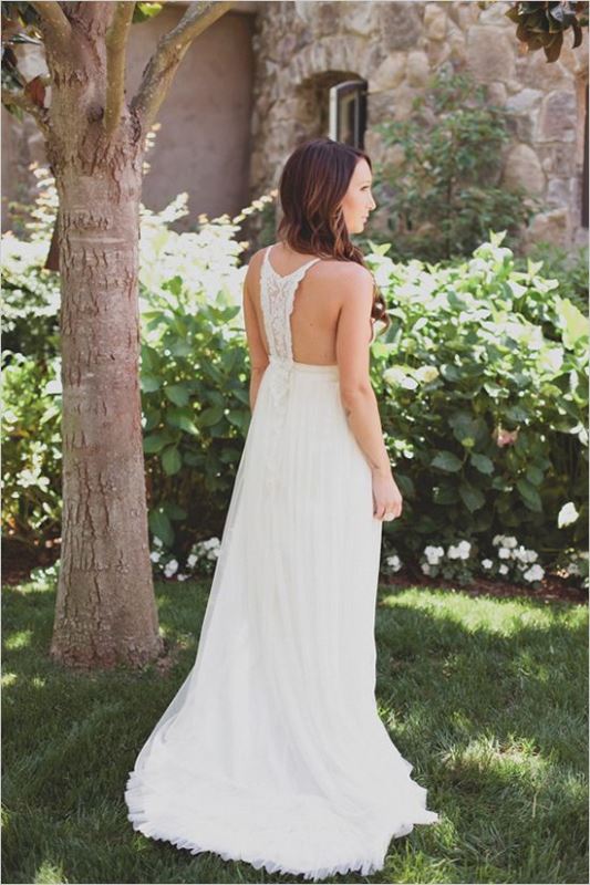 A boho plain wedding dress with a macrame racer back and no sleeves looks chic and feels relaxed