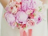 hot pink and peachy peony wedding bouquet with long ribbons is a bold idea for a spring or summer bride