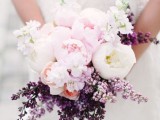 blush and white peonies and lilac compose a beautiful spring wedding bouquet is a chic and beautiful idea