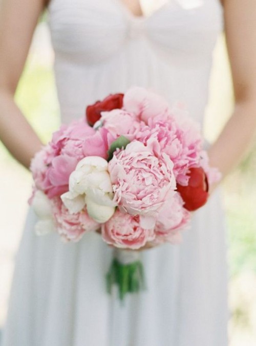 a bright wedding bouquet of white and pink peonies and red ones for a brighter touch is a lovely idea for spring or summer