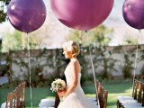 radiant orchid balloons decorating the aisle chairs are amazing to make the space look modern and fun