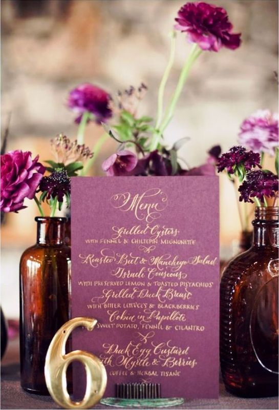 A radiant orchid wedding menu with gold lettering, radiant orchid blooms in apothecary bottles for a refined wedding centerpiece