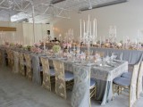 grey tables, pink and green blooms, candles and matching lace chair covers