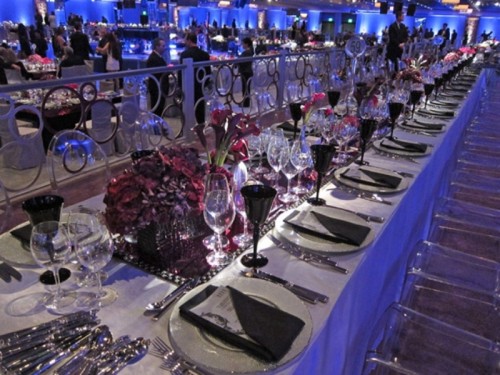 long fuchsia and burgundy bloom centerpieces and runners plus black glasses to contrast