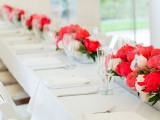 long colorful floral centerpieces contrast the neutral tables