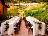 white tablecloths and greenery and bloom table runners for a timeless reception