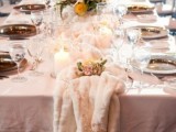 a winter tablescape with a fur table runner