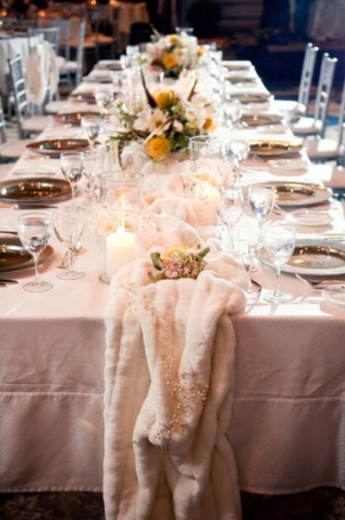a white faux fur table runner is ideal to add a soft and cozy touch to your winter wedding tablescape