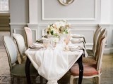 a white airy wedding table runner with a lace ribbon bow is a refined and stylish touch to the table setting