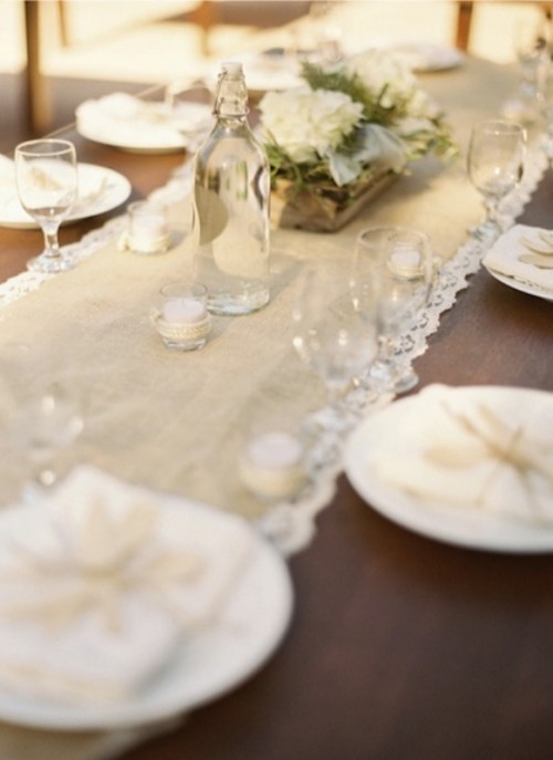 a burlap and lace wedding table runner is a perfect match for a vintage rustic wedding table setting