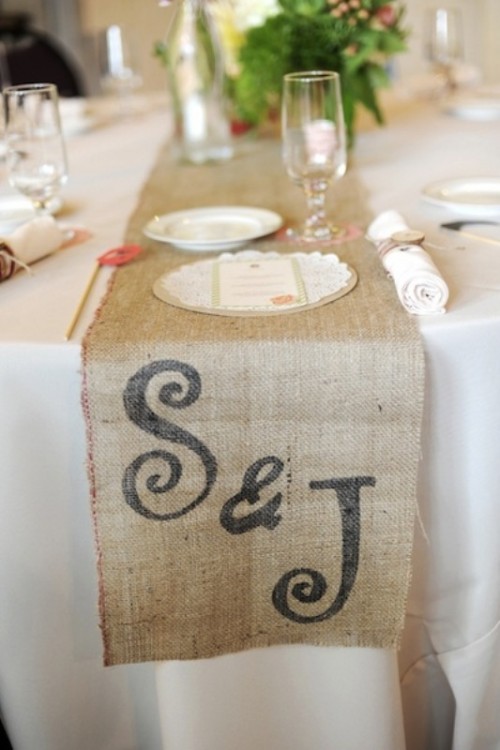 a burlap wedding table runner with monograms always works for rustic and woodland weddings