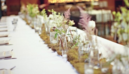 a moss wedding table runner with herbs, wildflowers and foliage is a very cool idea for a woodland wedding