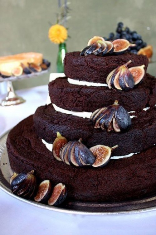 a naked chocolate wedding cake with cream and fresh figs is a lovely idea for a fall wedding is a delicious and yummy-looking idea