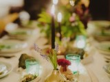 go for delicate and relaxed wedding reception decor – with wildflowers, candles, rocks and geodes