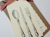 a rustic vintage rehearsal dinner invitation with cardboard, vintage cutlery printed and a cute invitation plus a plaid ribbon
