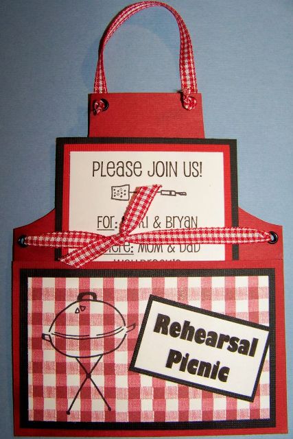 a bright red apron-shaped rehearsal dinner invitation with a plaid part and plaid ribbons