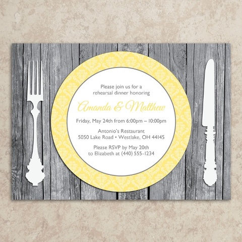 a stylish rustic rehearsal dinner invitation styled as a weathered wood placemat with elegant cutlery and a bright plate