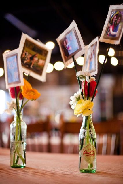colorful floral centerpieces with the couple's photos are great for a rustic rehearsal