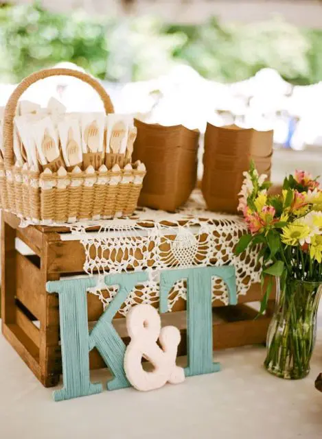 colorful wooden monograms and a basket with cutlery are what you need for a sweet rustic celebration