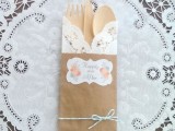 cardboard and craft paper bags with wooden cutlery for a rustic wedding or rehearsal