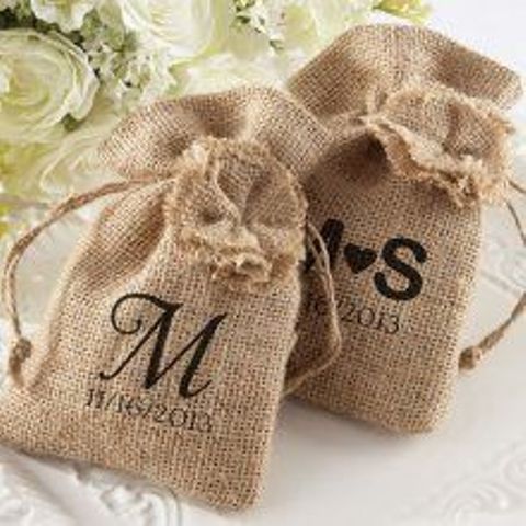 monogrammed burlap sacks to place favors inside or to make welcome bags