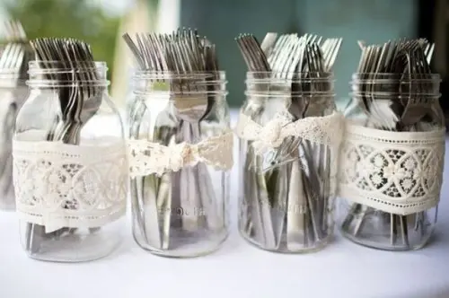 lace decorated jars with cutlery are right what you need for a rustic rehearsal