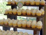 a rustic ladder-style wedding dessert stand with sweets and cupcakes is a simple and cool solution to rock