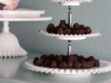 a delicate white tiered sweets stand will do for many desserts and will fit many wedding types, styles and themes