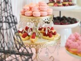 a refined tiered wedding dessert stand with patterns and hanging crystals is a refined and chic idea for many weddings, will fit a formal one