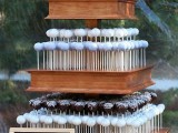 a tiered wood box stand is a great idea for cake pops, it allows to serve them right and at their best