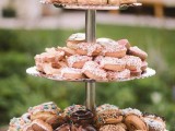 a stylish metal dessert stand with a ruffle edge will fit most of modern weddings and rustic ones, too
