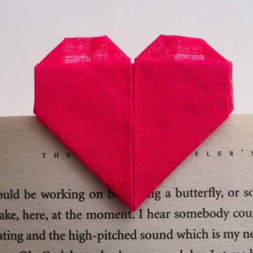 a red origami heart bookmark can be a nice and budget-friendly favor idea for a wedding