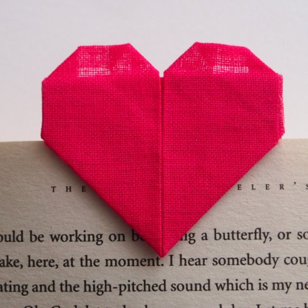 a red origami heart bookmark can be a nice and budget friendly favor idea for a wedding