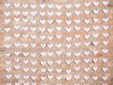 paper origami hearts as escort cards are amazing for a wedding with a touch of DIY and whimsy