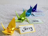 colorful origami cranes with tags are great as escort or seating cards, they will add a touch of color and interest to your reception space