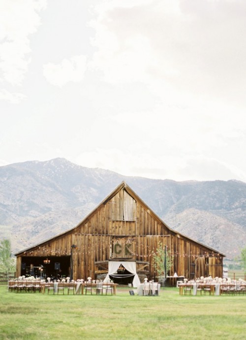 a barn with a mountain view is a great idea for a rustic yet adventuruous wedding, and the backdrop will be amazing