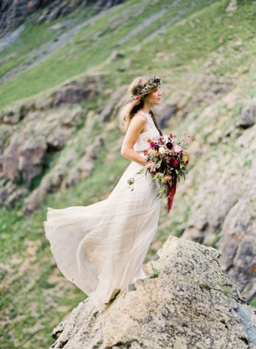 a gorgeous mountain bridal portrait with a wild fall-colored bouquet and a matching floral crown