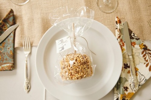 candied apples covered with nuts are amazing and delicious fall wedding favors that will make everyone absolutely happy
