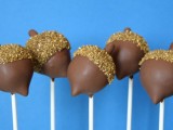 chocolate acorns on sticks are delicious and very cute fall wedding favors and you can DIY them if you feel like it