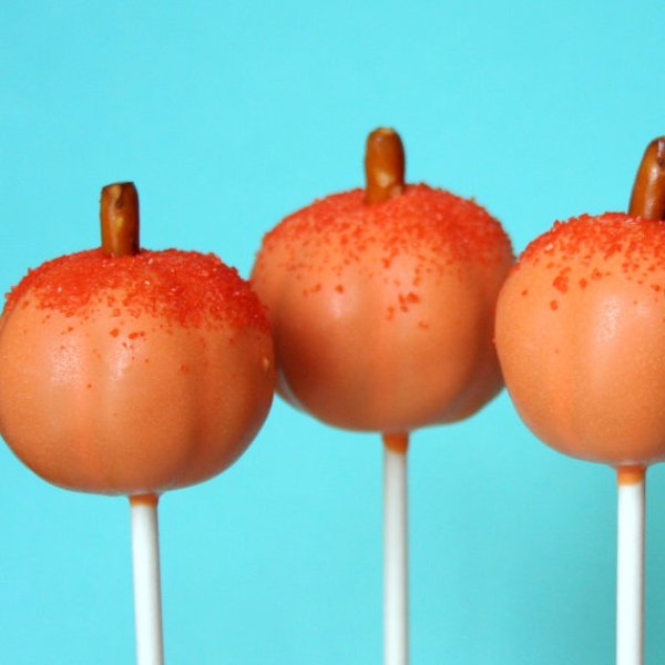 Pumpkin shaped mini cakies on sticks are amazing and fun fall wedding favors that everyone will enjoy