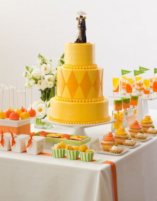 a bold yellow wedding cake with beads and rhombs and a traditional cake topper for a retro-inspired wedding