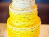 a bold ombre textural ruffled wedding cake from neutrals to deep yellows is a traditional and bold idea for a spring or summer wedding