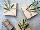 wrap your wedding favors with some kraft paper and olive greenery on top for a cozy and natural look