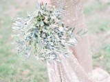 an olive branch wedding bouquet with olives is a cool idea to substitute a usual floral or greenery wedding bouquet